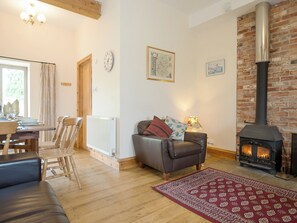 Warm and inviting living room with wood burner | The Stable, Foxham, near Chippenham
