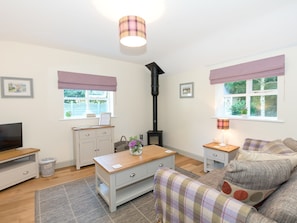 Cosy living area with wood burner | Cherry Laurel - Cherry Garth Cottages, Thornton le Dale near Pickering