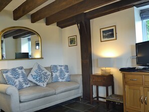 Cosy living area with wood burner | The Pigsty Cottage, Oswestry