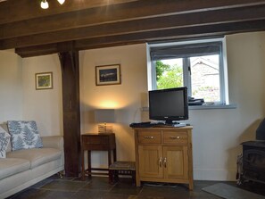 Cosy living area with wood burner | The Pigsty Cottage, Oswestry