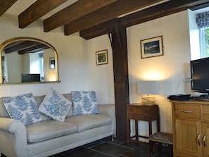 Cosy living area with wood burner | The Pigsty Cottage, Oswestry