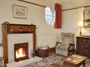 Living room with cosy open fire | Colville House, Helmsley