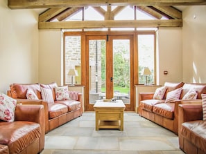 Charming living room with beamed ceiling and slate floor | The Farmhouse at Gradbach, Gradbach near Buxton
