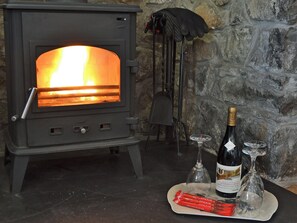 Beautifully presented living room with wood burner | Didfa, Llangoed, near Beaumaris