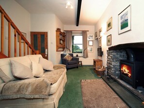 Charming living room with feature fireplace | Ivy Cottage, Giggleswick near Settle