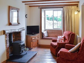 Cosy and inviting living area with woodburner | Gunluck Cottage - West End Farm Cottages, Brompton by Sawdon