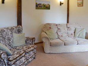 Comfy seating within living room | Clyst William Barn - Little Clyst William Farm Cottages, Plymtree, near Cullompton