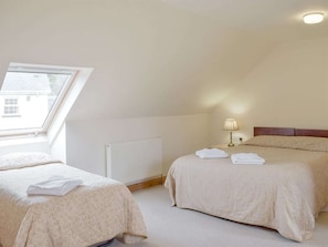 Double bedroom with an additional single bed | Pentre Cottage - Three Rivers Farm Cottages, Ferryside