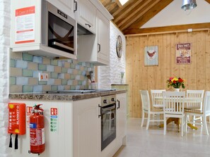 Well-equipped fitted kitchen | The Chaff House - Milton End Farm Barns, Arlingham, near Frampton-on-Severn