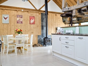 Open-plan living area with heritage architectural feature | The Chaff House - Milton End Farm Barns, Arlingham, near Frampton-on-Severn