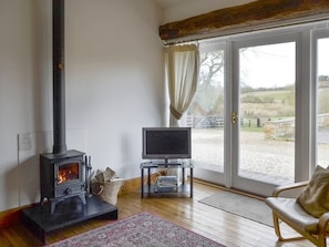 Warming wood burner within living area | The Bridles - Ash Farm Barns, North Willingham, near Market Rasen