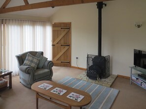 Warm and cosy living room with wood burner | The Stables, Thrigby, Great Yarmouth