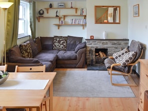 Charming living area with feature fireplace | Willow Cottage, Newquay