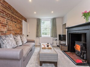 Comfortable living room with wood burning stove | Pond Cottage, Boldre, near Lymington