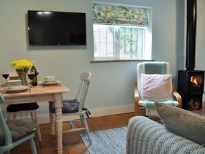 Cosy living/dining room with wood burner | The Blue Loft, Playden, near Rye