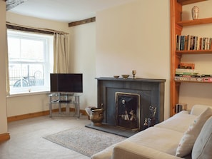 Living/ dining room with cosy open fire | Bridge House, Threlkeld
