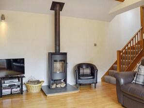 Cosy wood burner in the living area | The Hayloft, Kidderminster