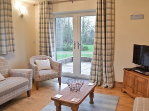 Open plan living room with patio doors | The Old Coach House, Ulrome near Bridlington