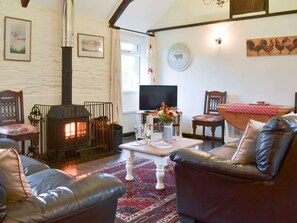 Living room boasting attractive beamed A-framed ceilings | Trenay Barn Cottage, St Neot, near Liskeard