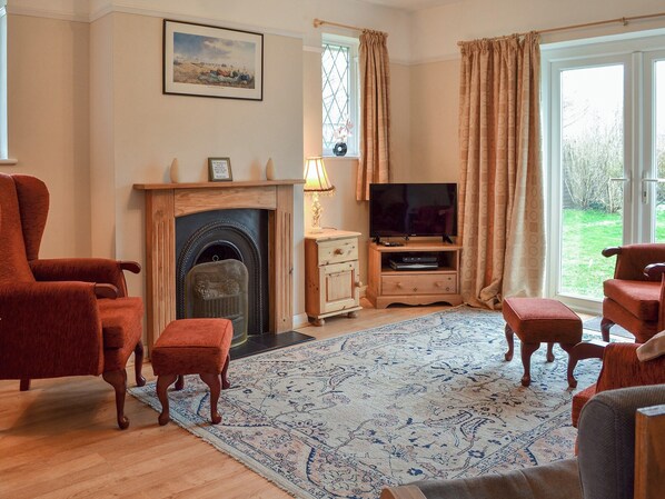 Lovely living room with patio doors to garden | The Glade, Ferring, Worthing