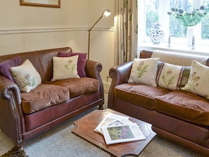 Comfy seating within living room | Duffs Lodge - Beaufort Cottages, Kiltarlity, near Beauly