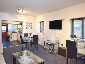 Modest dining area and through kitchen | South Lodge Cottage, Worthington, near Standish