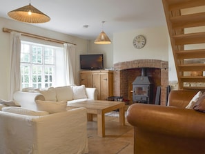 Delightful living area with wood burner | South View Cottage, Dean, near Chadlington