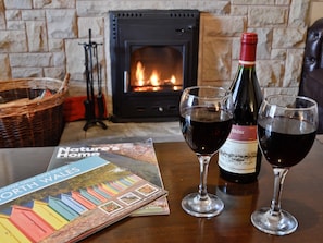 Welcoming wood burner in the living room | Bryn Euryn Cottage, Rhos-on-Sea, near Colwyn Bay