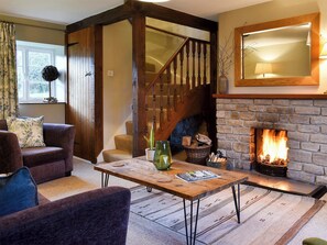 Cosy and warm living room with open fire | Barters Cottage, North Chideock, near Bridport