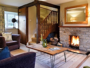 Cosy and warm living room with open fire | Barters Cottage, North Chideock, near Bridport