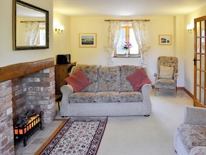 Lovely living room with feature fireplace | Carters Cottage - The Old Timberyard, Puncknowle, near Dorchester
