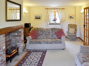 Lovely living room with feature fireplace | Carters Cottage - The Old Timberyard, Puncknowle, near Dorchester