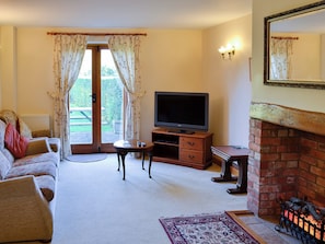 Spacious living room with access to the garden | Carters Cottage - The Old Timberyard, Puncknowle, near Dorchester