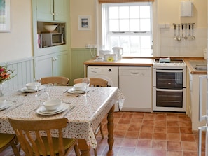 Well-equipped kitchen with dining area | Lighthouse Cottage, Happisburgh, near Cromer