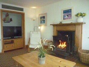Welcoming living room with wood burner | Tigh an Uillt, Strachur, near Inveraray