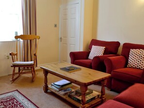 Cosy living room with multi-fuel burner | Kirsty Cottage, Moffat