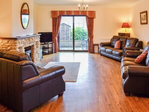Living room with doors to garden | Canon Court Farmhouse, Milborne Port, near Sherborne