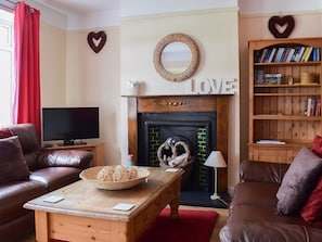 Delightful living room with feature fireplace | Valentine Cottage, Keswick