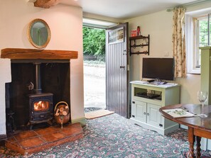 Front door opening directly onto the open plan living area | Cerne Abbey Cottage, Cerne Abbas