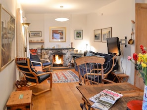 Warm and cosy living/dining room with open fireplace | The Larches, Seldom Seen near Thornthwaite