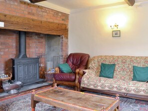 Feature fireplace in living room | The Coach House, Craven Arms
