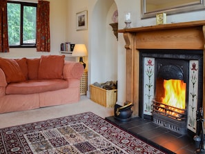 Cosy living room with open fireplace | Bramble Cottage, Meigle