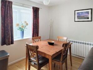 Comfortable living area and dining table and chairs | Erskine Cottage, Seahouses
