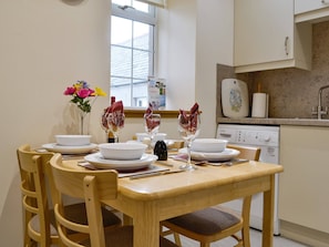 Convenient dining area within kitchen | Mill Shore Cottage - Nethermill Cottages, Pennan, near New Aberdour