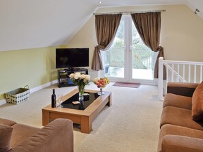 Cosy lounge with french doors | Lake View Cottage - Rosecraddoc Manor, Liskeard