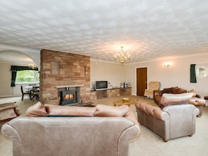 Grand living room with wood burner | Oaklands, Langrigg, near Cockermouth