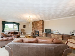 Spacious living area with wood burner | Oaklands, Langrigg, near Cockermouth