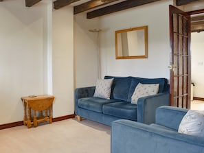 Living room with beamed ceiling | Black Bull Cottage, Ugthorpe, near Whitby