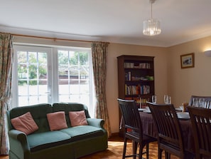 Dining room with French doors and wooden floor | Mariners Lodge, Felixstowe Ferry