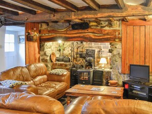 Traditional beamed living room with comfortable leather furniture | Hen Hafod, Bala